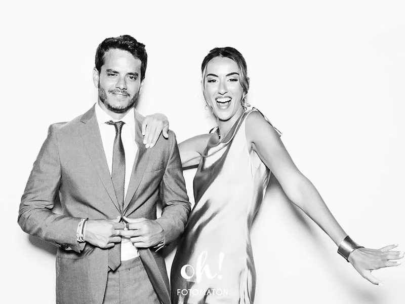 Elegant couple having fun,a boy and a girl posing smiling in front of white background