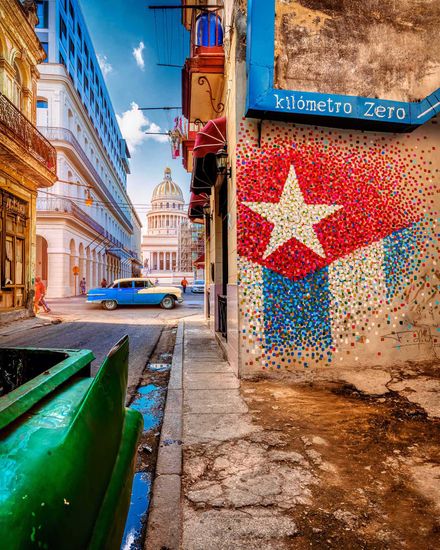 Cuban flags waving in the breeze in Havana, Cuba, symbolizing the country's pride and patriotism urban landscape in Havana, Cuba